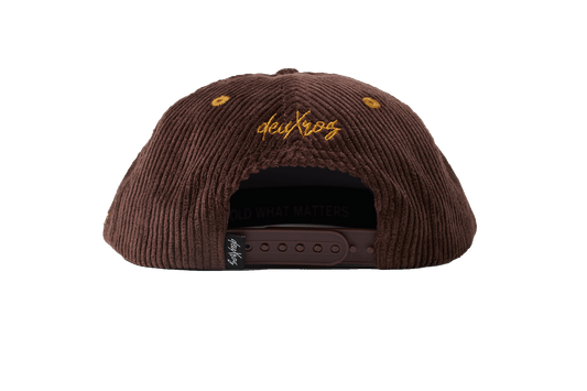 deuXros brown corduroy hat ghost back view, golden thread script at back, adjustable strap closure with woven label