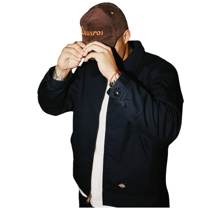 deuXros brown corduroy hat men’s lifestyle shot, mid-profile soft crown, golden thread embroidery