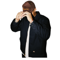 deuXros brown corduroy hat men’s lifestyle shot, mid-profile soft crown, golden thread embroidery