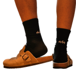 deuXros ink crew sock with embroidered script at the achilles, styled with tan suede sandals