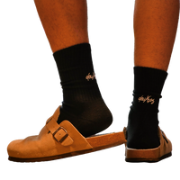 deuXros ink crew sock with embroidered script at the achilles, styled with tan suede sandals