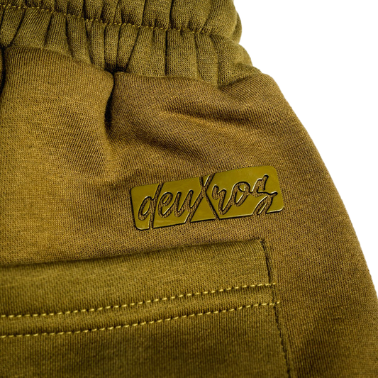 Color: Field Moss sweatpants waistband and logo close-up, elastic waistband, back pocket detail