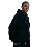deuXros ink hoodie women's upper body lifestyle shot, overlapped neckline, tonal matte 3d rubberized box logo
