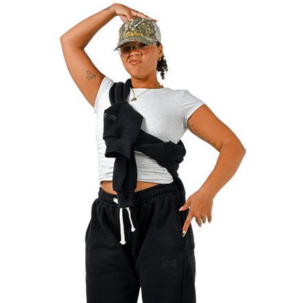 Color: Ink sweatpants women’s lifestyle shot, relaxed tapered fit, elastic waistband, styled with white tee