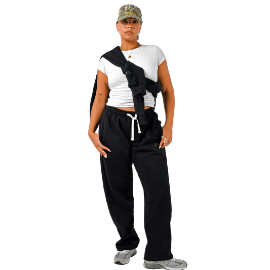Color: Ink sweatpants full body women’s lifestyle shot, relaxed tapered fit with drawcords