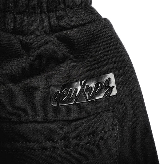  Color: Ink sweatpants waistband and logo close-up, elastic waistband, back pocket detail