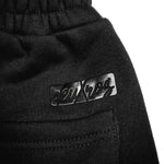  deuXros ink sweatpants waistband and logo close-up, elastic waistband, back pocket detail