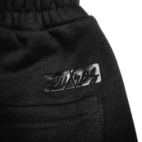  deuXros ink sweatpants waistband and logo close-up, elastic waistband, back pocket detail
