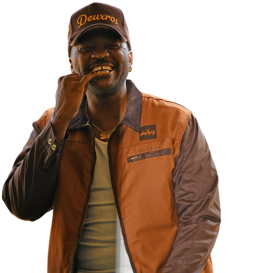 deuXros brown canvas jacket lifestyle shot, date detail and embroidered script at chest, styled with deuXros corduroy hat