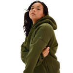 Person wearing a field moss deuxros hoodie on a white background