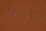 Close-up of deuxros logo on brown leather