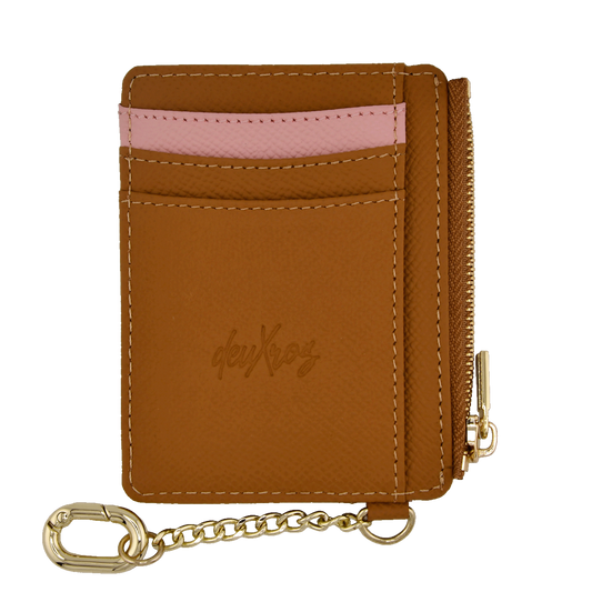 A brown leather card holder wallet with a pink textured stripe across the middle, a gold zipper, and a gold keychain attachment. The brand name 'deuXros' is embossed on the front.